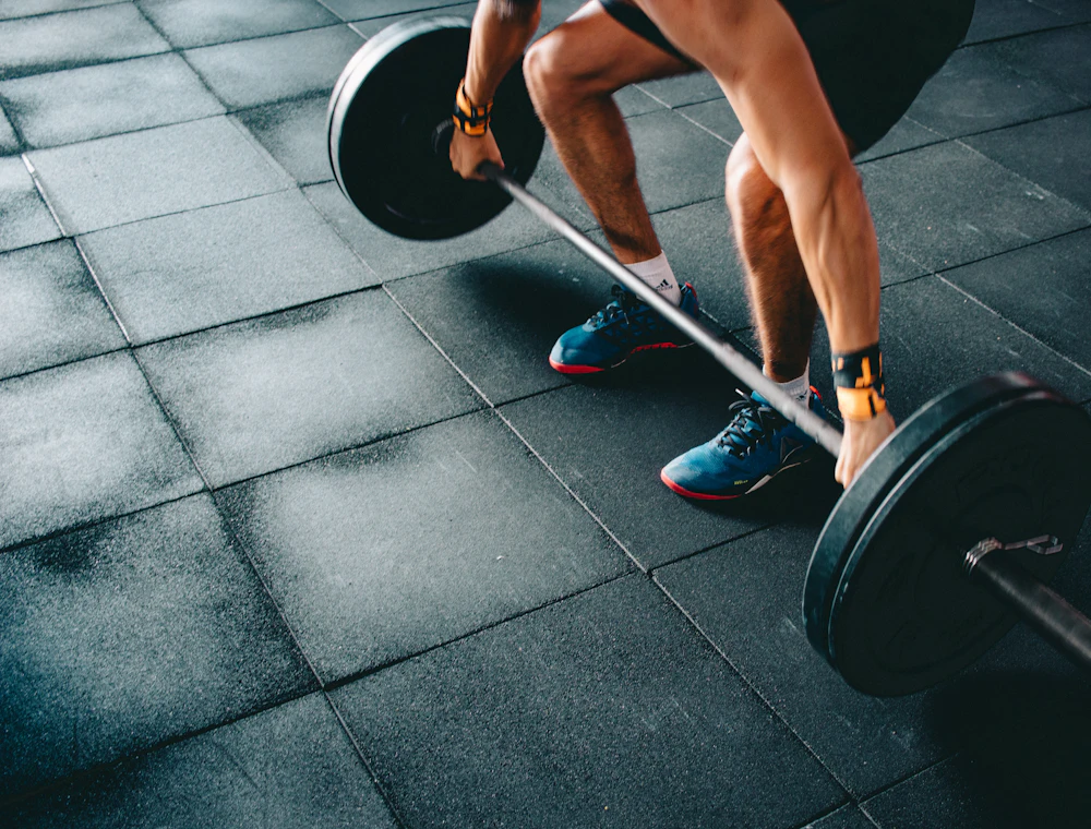 A lifter setting up for a barbell deadlift