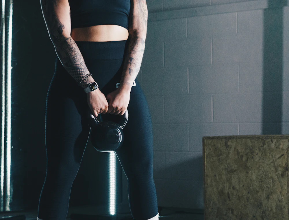 An athlete holding a kettlebell
